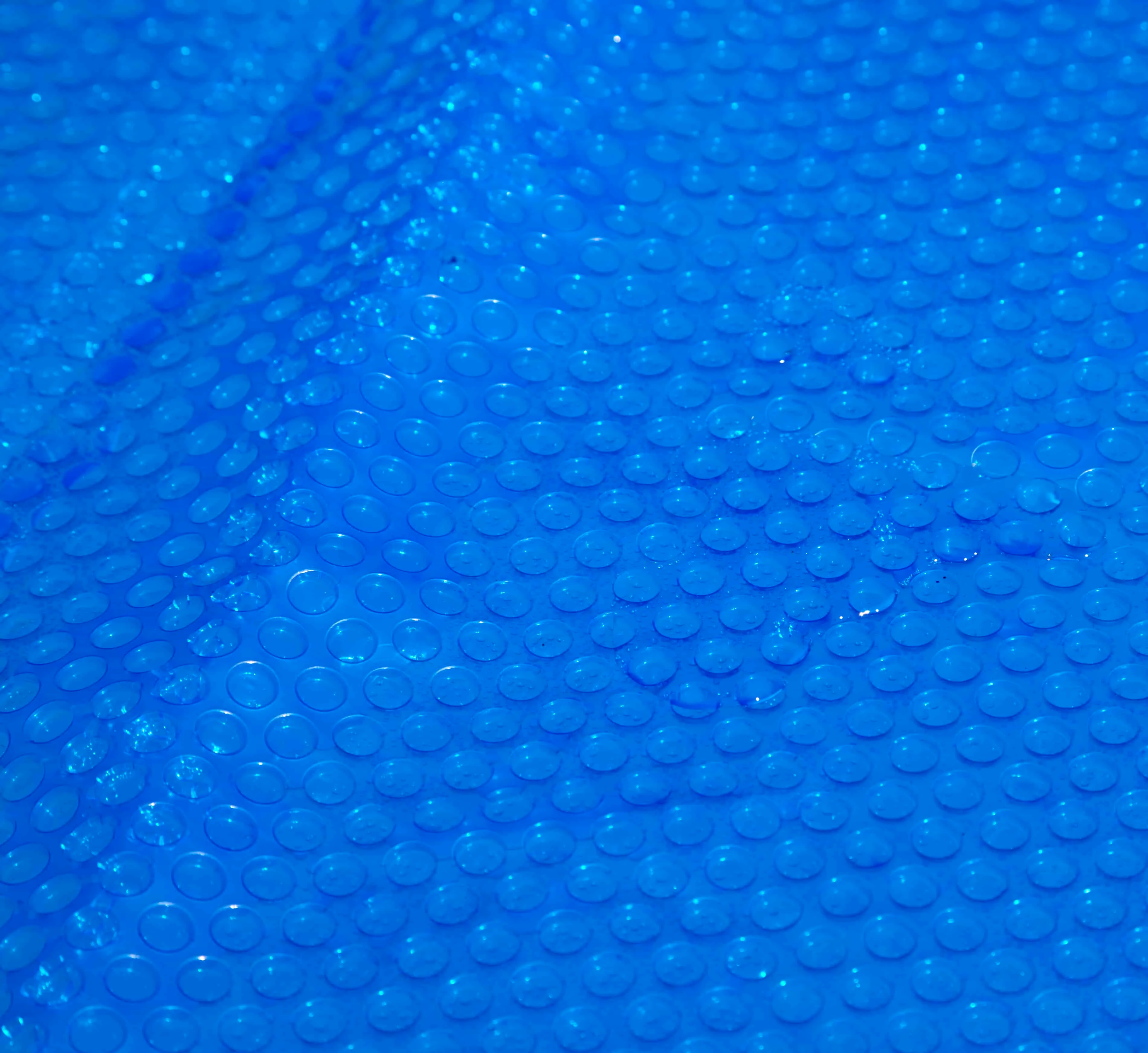 Blue solar pool cover