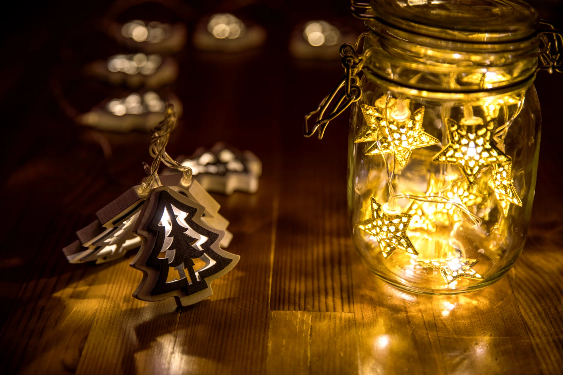 Christmas fairy lights in a mason jar, glowing in the dark